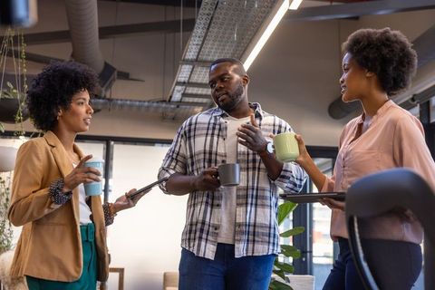 Diverse Colleagues Sharing Ideas in a Modern Office