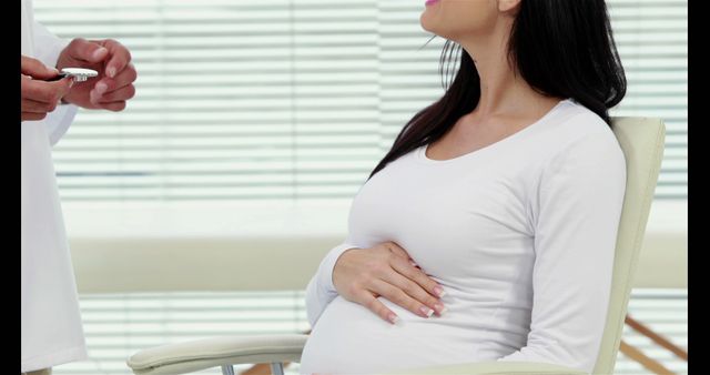 Pregnant woman consulting doctor in clinic - Download Free Stock Images Pikwizard.com