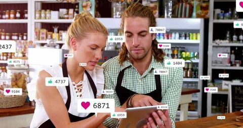 Coworkers in Shop Engaging with Social Media on Tablet