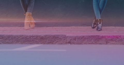 Casual feet on sidewalk with relaxed lighting