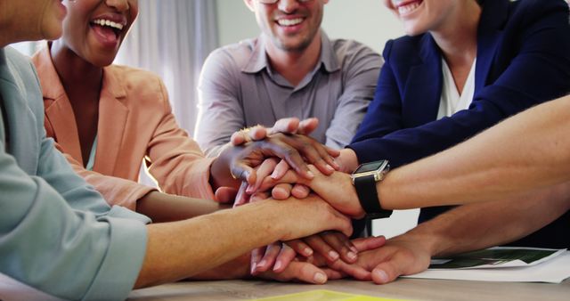 Diverse Team Celebrating Success with Group Handshake in Office Meeting - Download Free Stock Images Pikwizard.com