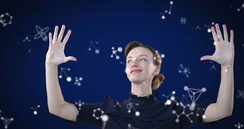 Woman Engaged with Virtual Molecules Illustrating Innovation and Technology