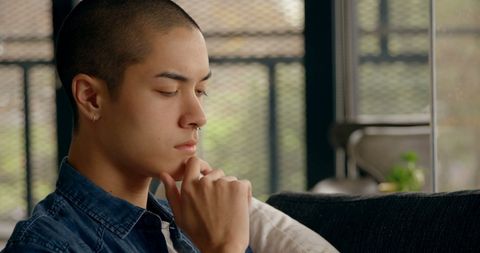 Young Man Contemplating Decisions Indoors - Download Free Stock Images Pikwizard.com