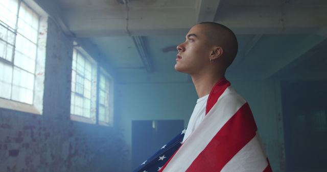 Patriotic Young Adult Deep in Thought Draped in USA Flag - Download Free Stock Images Pikwizard.com