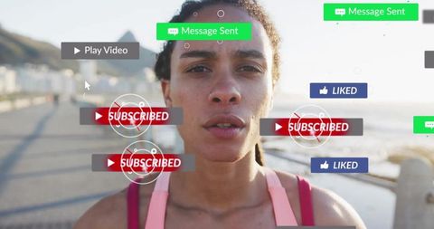 Female athlete interacting with digital notifications on boardwalk