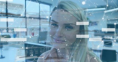 Smiling professional woman interacting with augmented data overlays in modern office