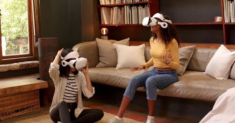 Friends Exploring VR Experience in Modern Living Room