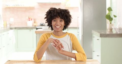 Cheerful Woman Enjoying Time in Modern Kitchen