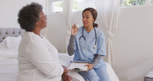 Healthcare Professional Giving Medical Advice to Senior Patient - Download Free Stock Images Pikwizard.com