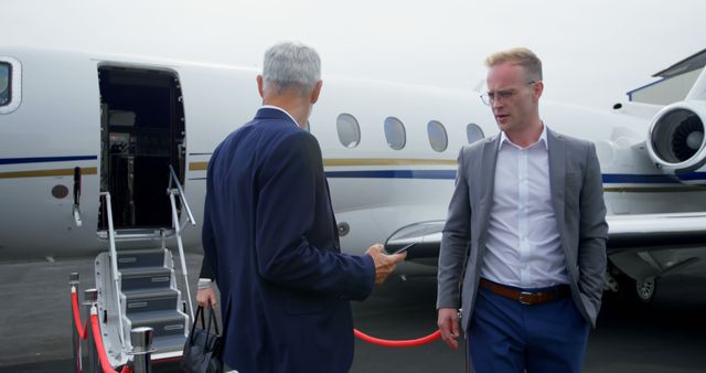 Business people leaving private jet at terminal 4k