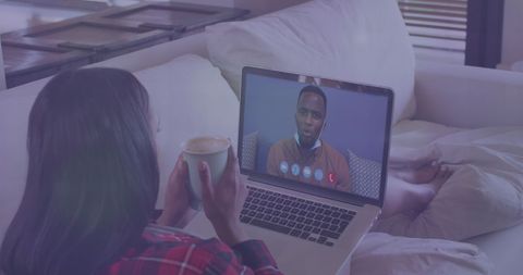 Woman Video Calling on Laptop with Coffee in Cozy Living Room