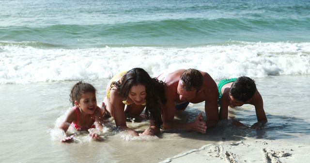 Family enjoying beach vacation playing in ocean waves. Parents and children bonding and having a fun time. Ideal for travel, holiday, and family life themes.