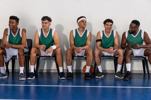 Team Spirit Among Basketball Players Relaxing on Sidelines