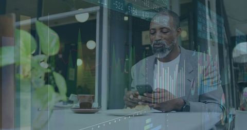 Business Professional Studying Financial Data at Coffee Shop