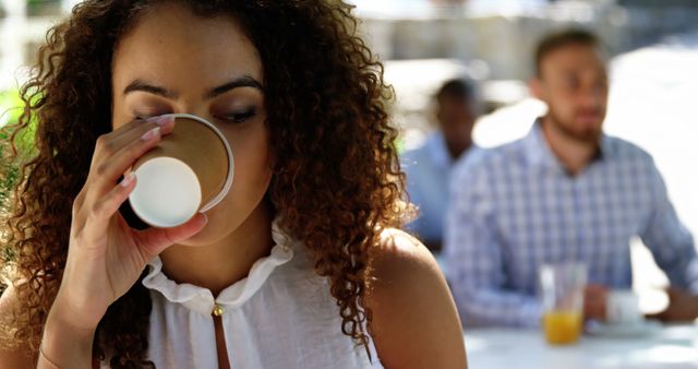 Woman Enjoying Coffee outdoors while Relaxing on Weekend - Download Free Stock Images Pikwizard.com