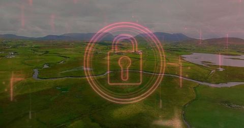 Neon padlock icon over lush rural landscape illustrating tech security