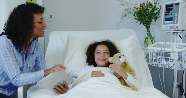 Mother visiting child in hospital with teddy bear - Download Free Stock Images Pikwizard.com