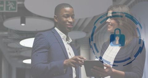 Business professionals reviewing cybersecurity on tablet with digital padlock HUD overlay