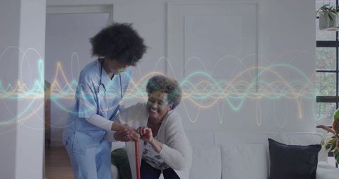 Caregiver supporting senior with cane at home, mobility care and remote monitoring