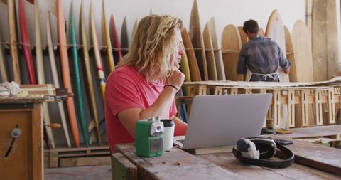 Crafting Surfboards and Utilizing Technology in Busy Workshop