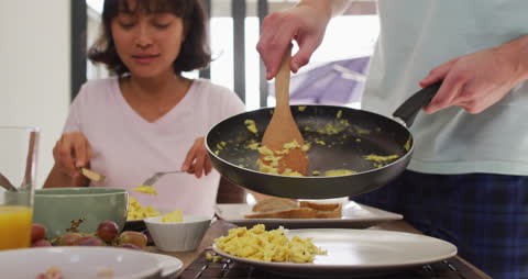 Happy Diverse Couple Enjoying Breakfast Together