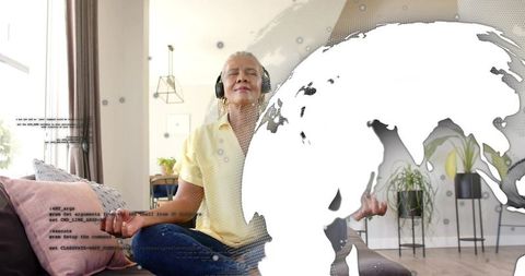 Senior woman meditating with headphones at home globe overlay for mindfulness and serenity