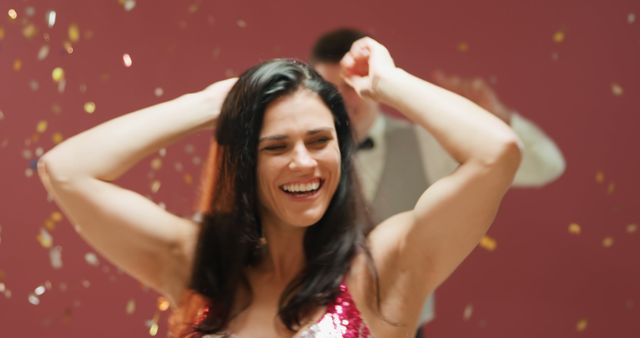 Smiling Woman Dancing at Party with Confetti - Download Free Stock Images Pikwizard.com