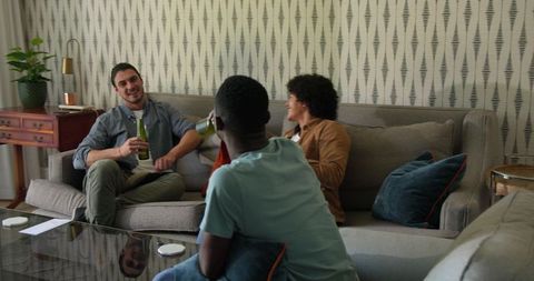 Friends sharing laughter and connection in cozy living room