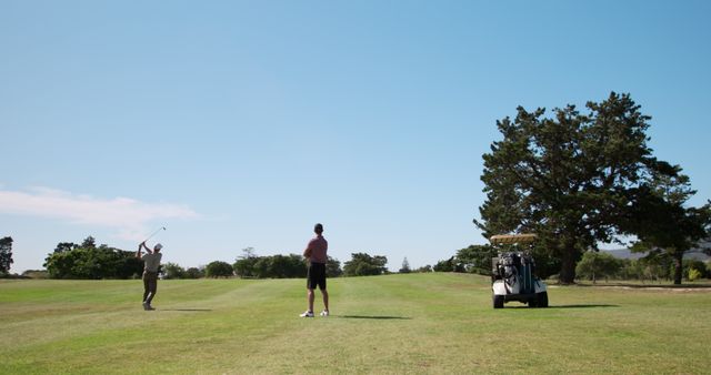 Men Playing Golf on Sunny Day with Golf Cart and Blue Sky - Download Free Stock Images Pikwizard.com