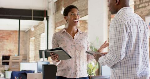 Colleagues Engaging in Discussion Sharing Business Ideas Office