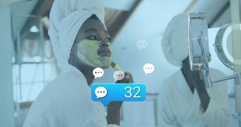 Woman applying facial mask with social media interaction