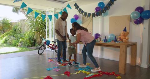 Diverse Family Celebrating Birthday with Colorful Decorations