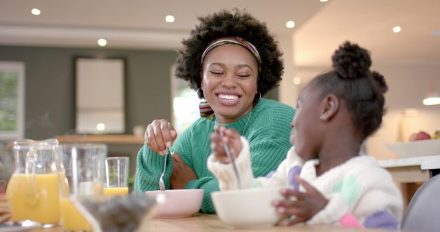 Smiling Mother and Daughter Enjoying Breakfast Together - Download Free Stock Images Pikwizard.com