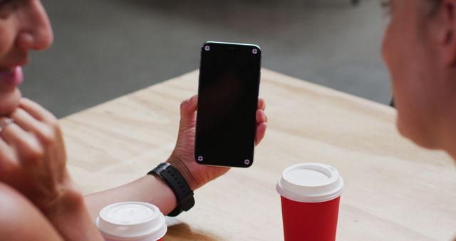 People Relaxing at Cafe with Smartphone and Coffee Cups - Download Free Stock Images Pikwizard.com