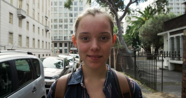 Young Woman Smiling Outdoors in Urban Setting - Download Free Stock Images Pikwizard.com