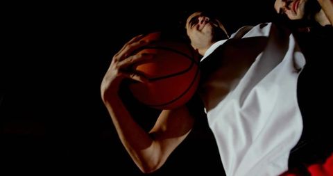 Athletic Action Player Preparing Powerful Dunk in Gymnasium