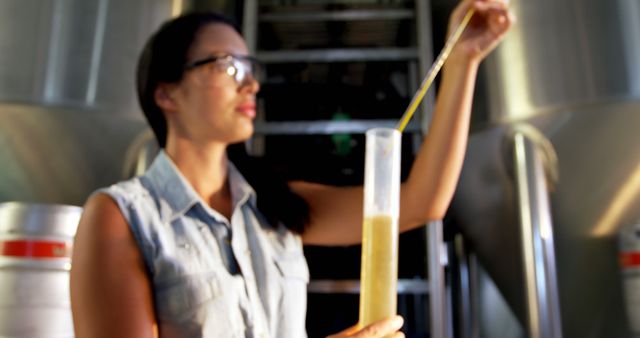 Female Brewer Measuring Fermentation Liquid in Brewery - Download Free Stock Images Pikwizard.com