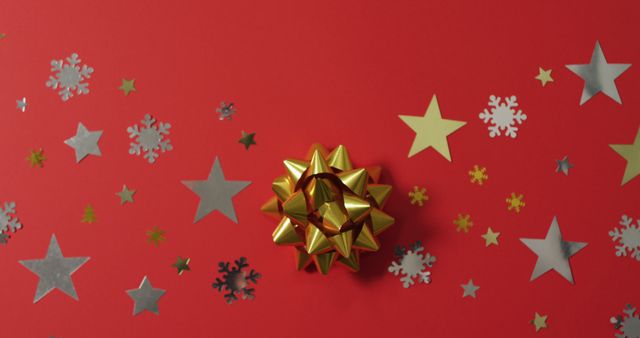 Christmas Gift Box with Golden Bow on Red Festive Background - Download Free Stock Photos Pikwizard.com