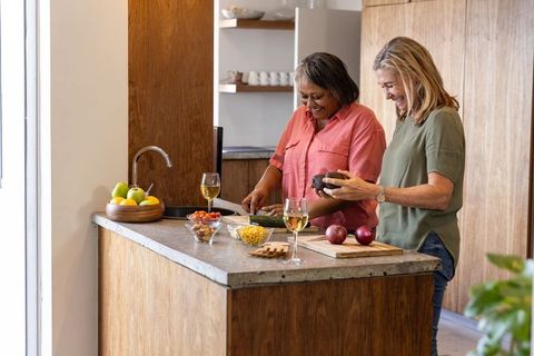 Senior Women Enjoying Culinary Activities in Modern Kitchen