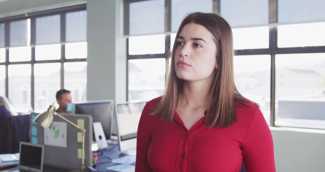 Thoughtful Businesswoman Contemplating Work Tasks in Modern Office - Download Free Stock Images Pikwizard.com