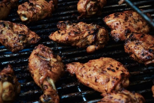 Grilled Chicken Drumsticks and Thighs on Barbecue Grill at Cookout - Download Free Stock Photos Pikwizard.com