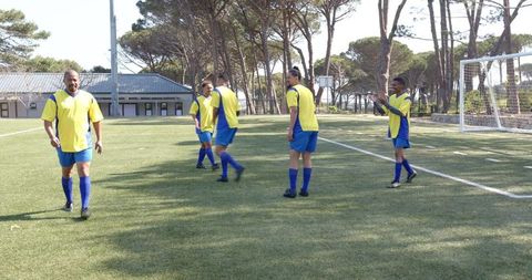 Soccer Players Practicing Passing and Teamwork on Field