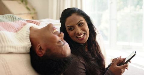 Joyful Couple Relaxing at Home Sharing a Happy Moment