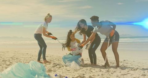 Diverse Volunteers Cleaning Beach at Sunset