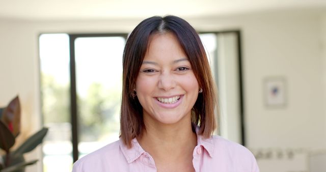 Smiling Woman in Bright Modern Home Environment - Download Free Stock Images Pikwizard.com