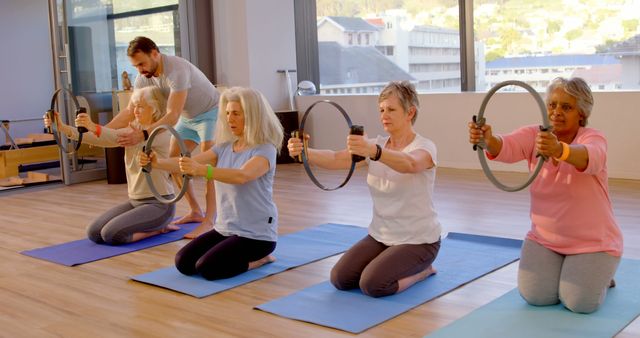 Senior Women Participating in Yoga Class with Instructor - Download Free Stock Images Pikwizard.com