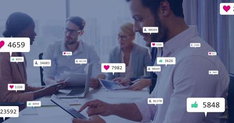 Professional Team Analyzing Social Media Analytics in Modern Office