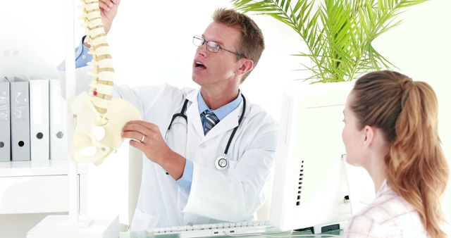 Doctor Explaining Spine Anatomy to Female Patient - Download Free Stock Images Pikwizard.com