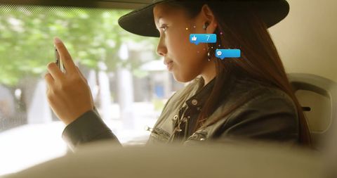 Biracial Woman Engaging with Social Media on Smartphone