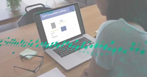 Man Reviewing Covid-19 Digital Certificate on Laptop at Workspace